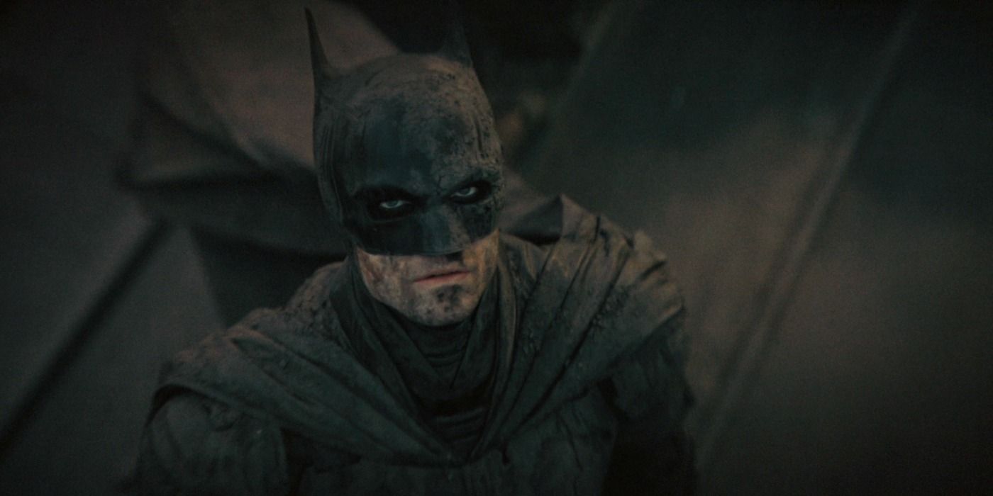 Batman covered in mud and floodwaters in the aftermath of Riddler's foiled plan