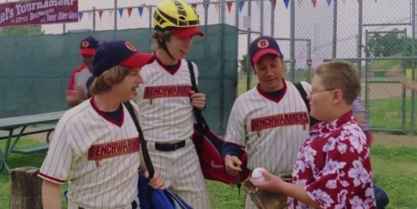 Jared Sandler talking to David Spade, Jon Heder and Rob Schneider at a baseball game in The Benchwarmers. 