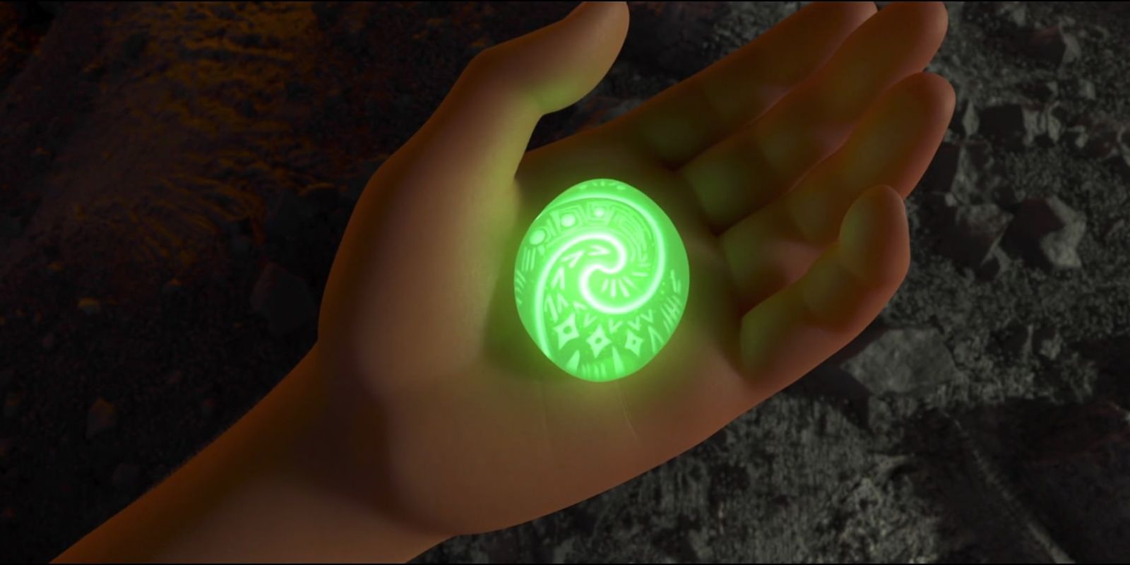 A hand holding the Heart of Te Fiti in Moana