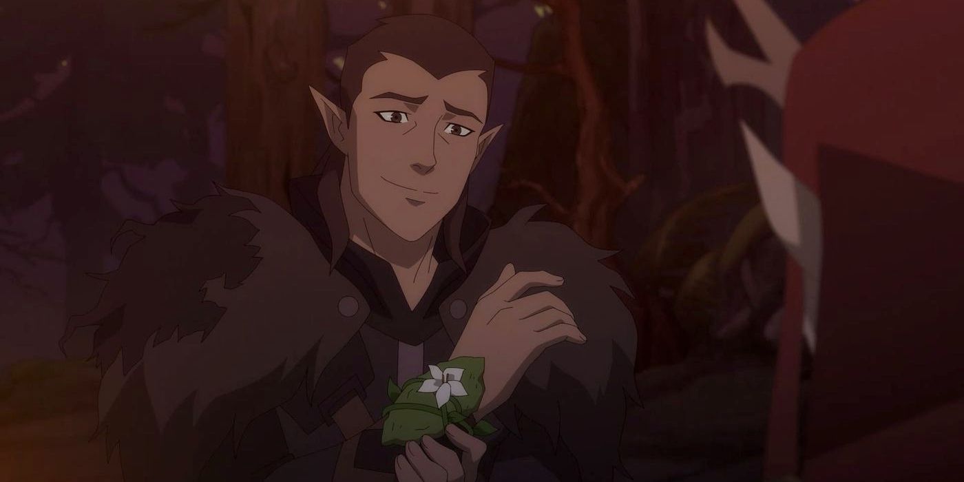 Vax'ildan, a brown haired half-elf rogue smiling gently in The Legend of Vox Machina