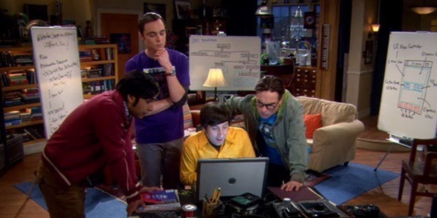 The guys sitting around a laptop on TBBT
