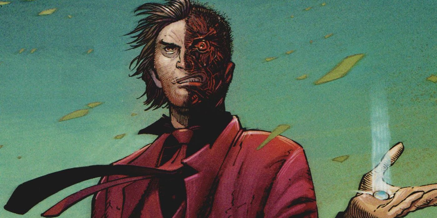 Two-Face standing in a field in DC comics.