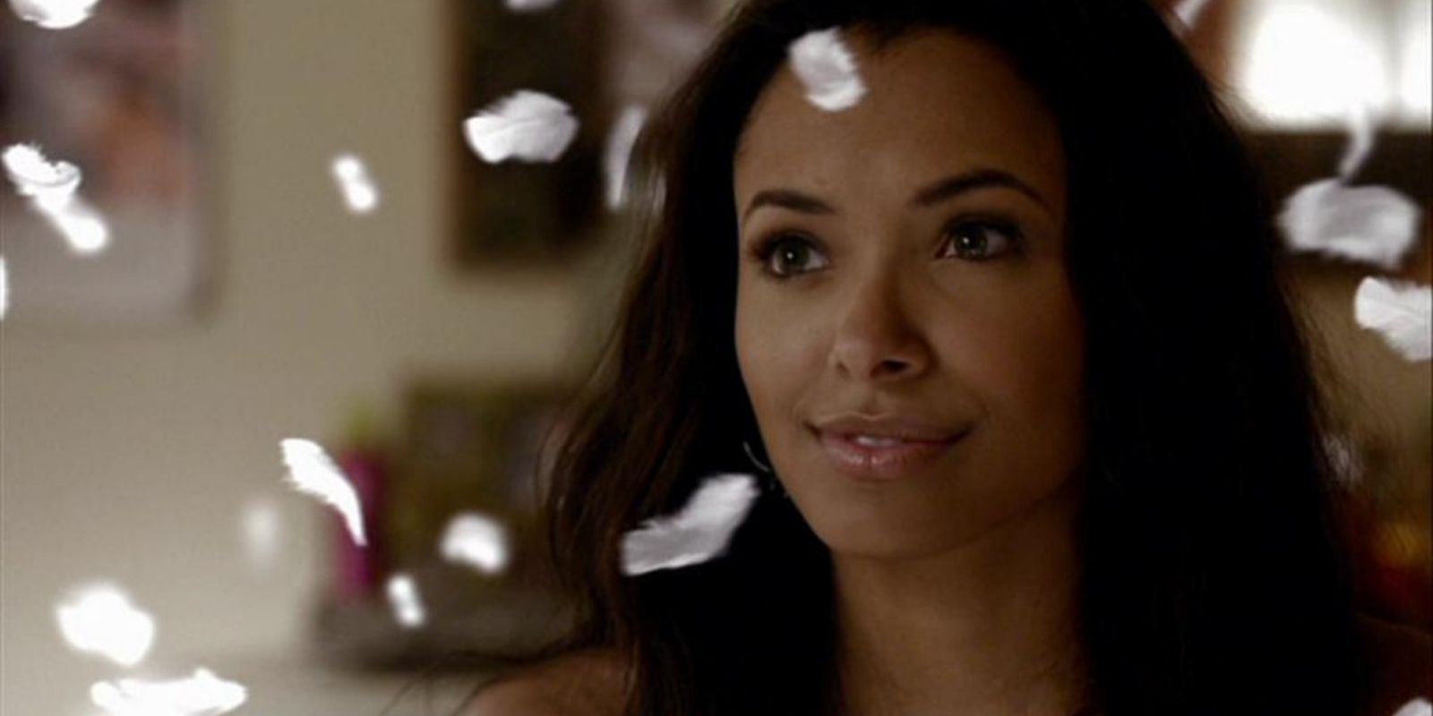 Bonnie surrounded by falling feathers in The Vampire Diaries