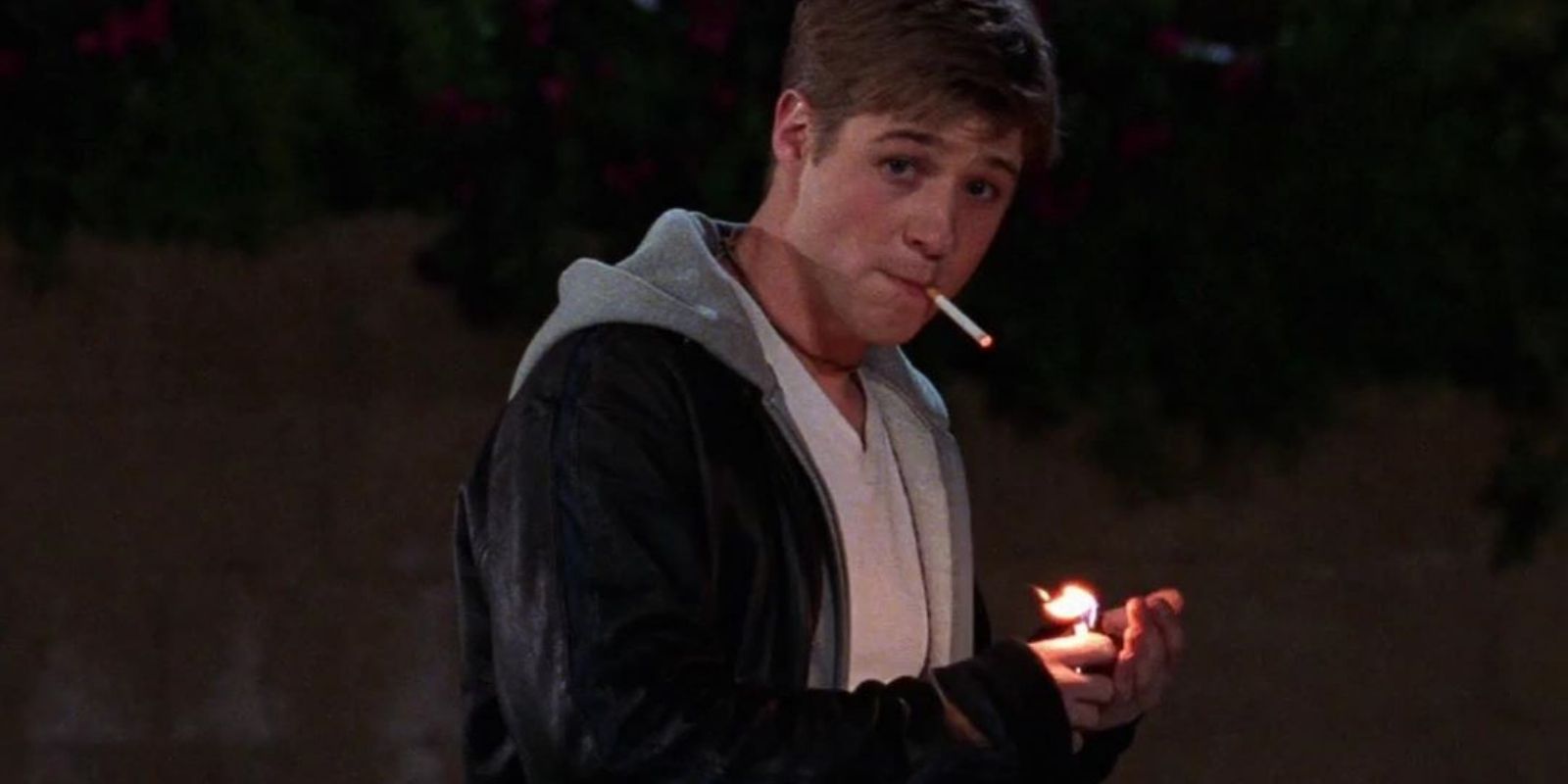 Ben McKenzie as Ryan smoking outside at night in The O.C.
