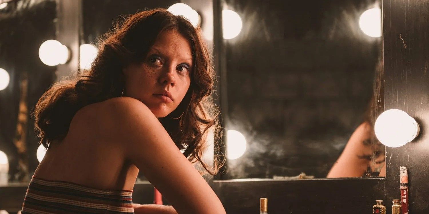Mia Goth sits in her dressing room in X