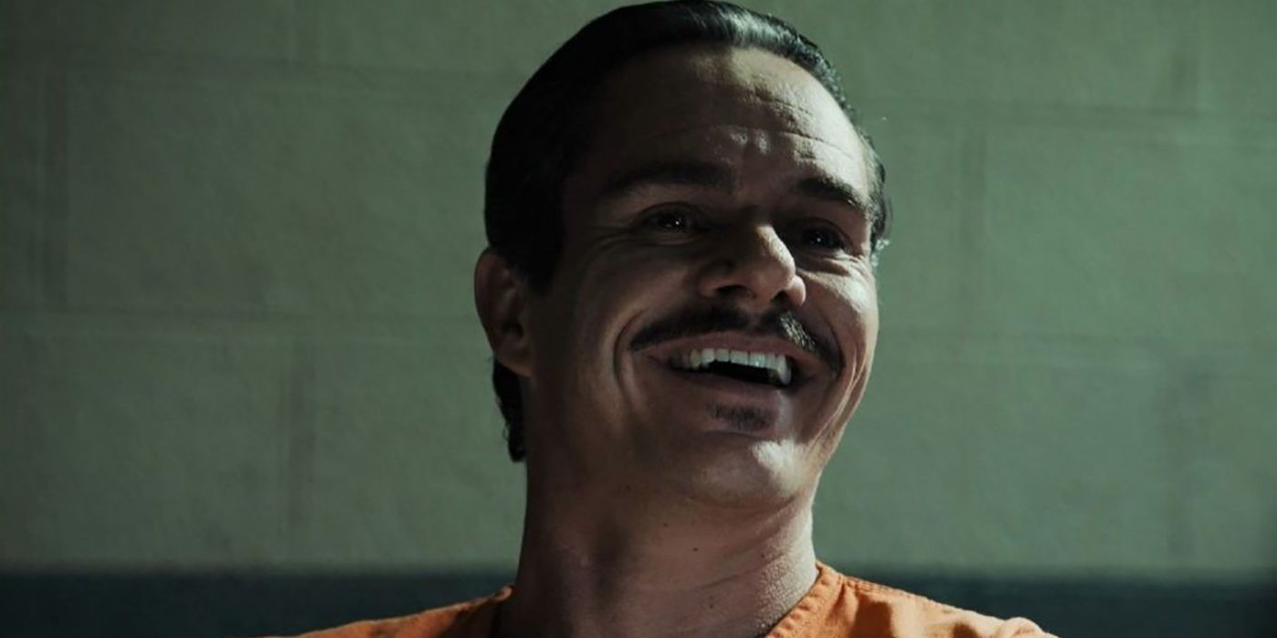 Lalo laughing in his prison jumpsuit, in a scene from Better Call Saul.
