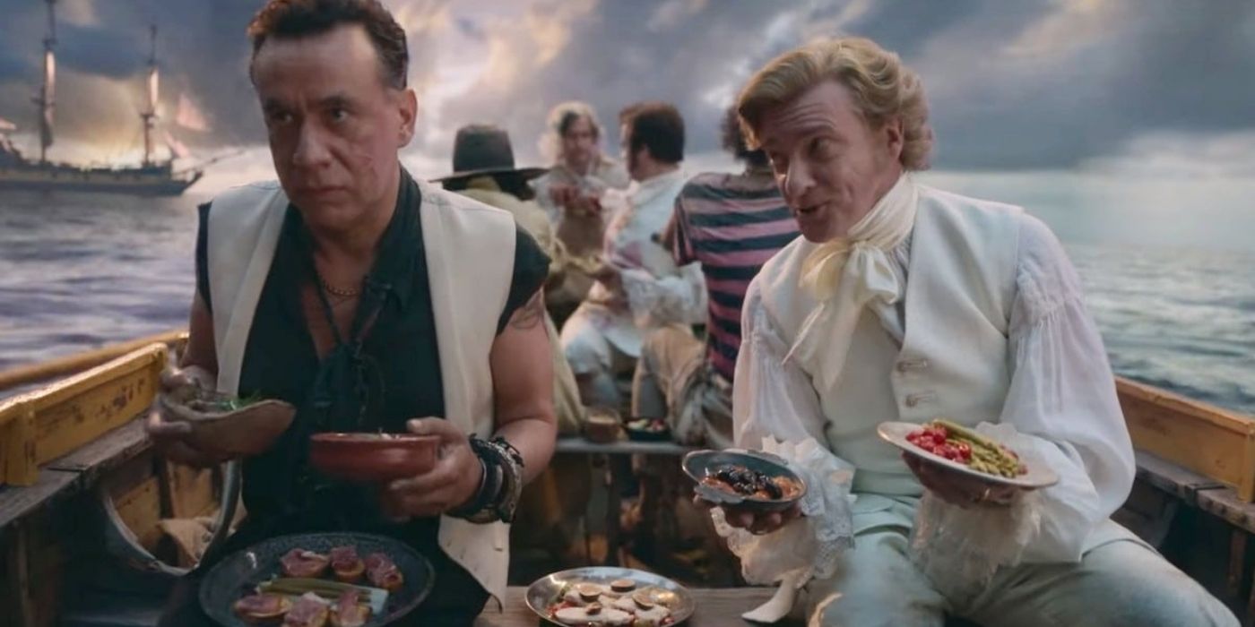 Fred Armisen and Rhys Darby on a boat holding tapas in Our Flag Means Death