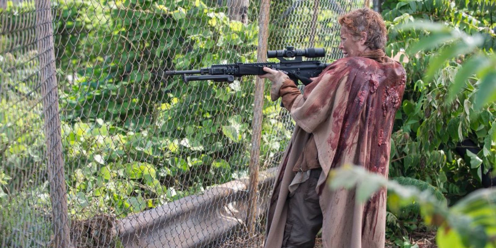 Carol at Terminus pointing a gun in The Walking Dead