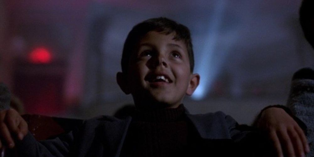 Sal watches a move in the theater in Cinema Paradiso