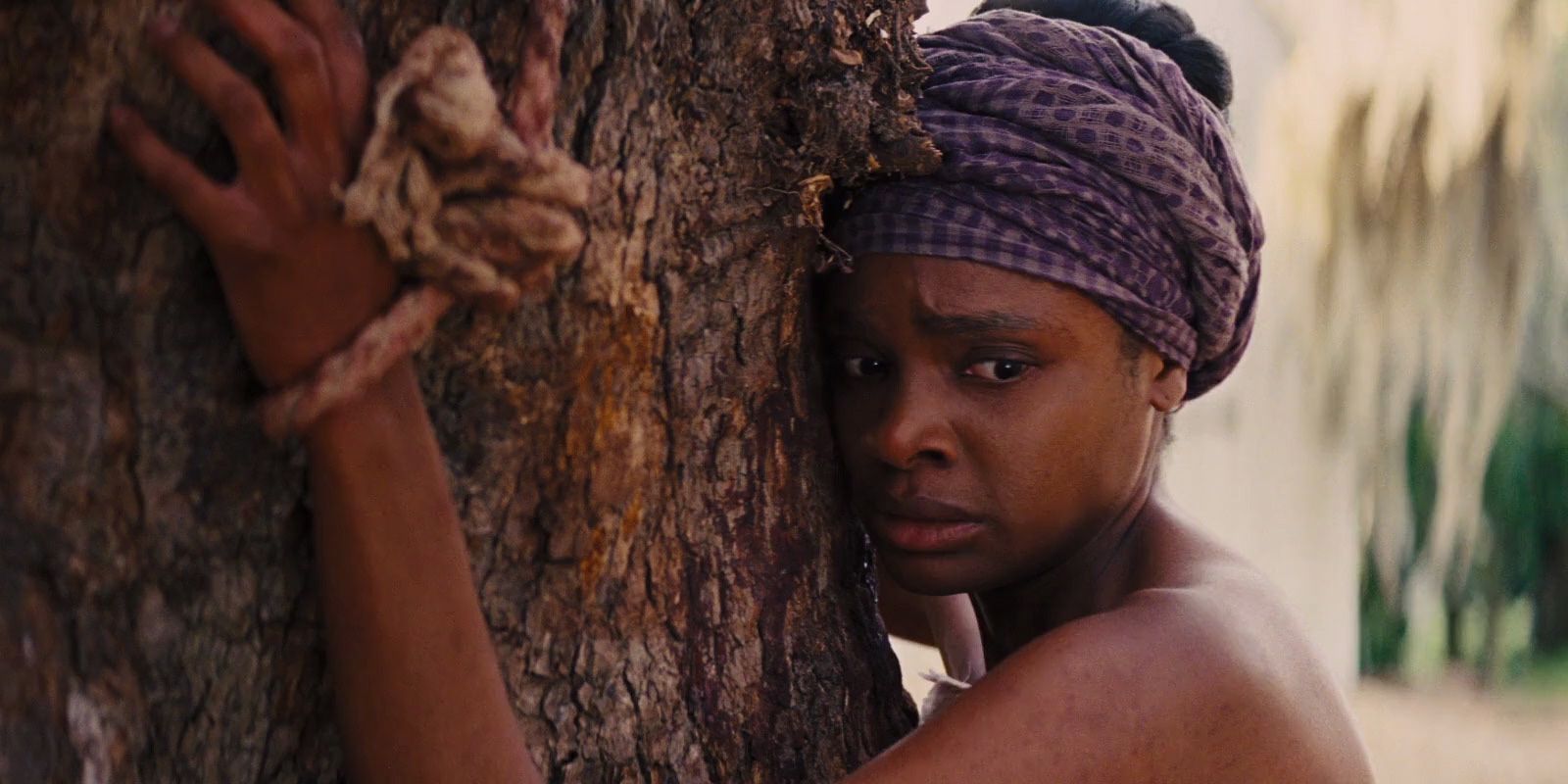 Woman tied to a tree in Django Unchained