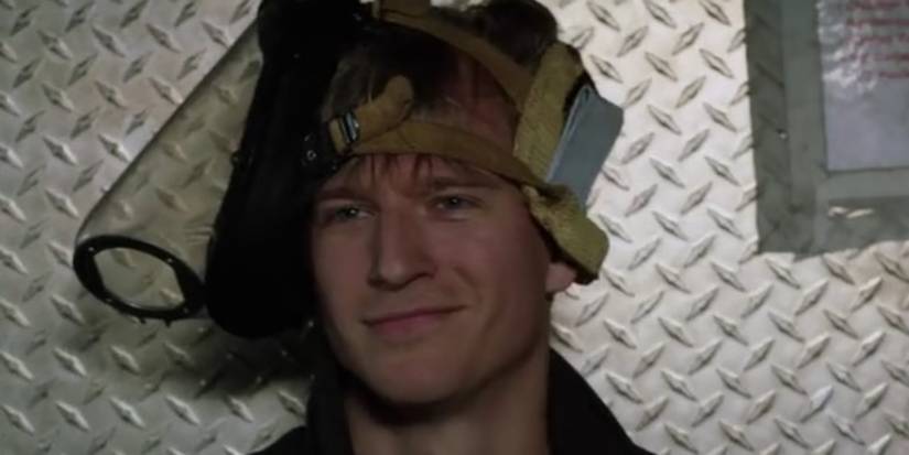 Andy Darden smiling in the firetruck in Chicago Fire