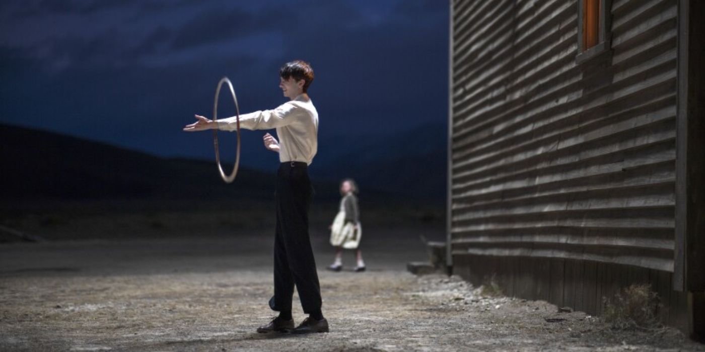 Peter spinning a hula-hoop round his arm in The Power of the Dog