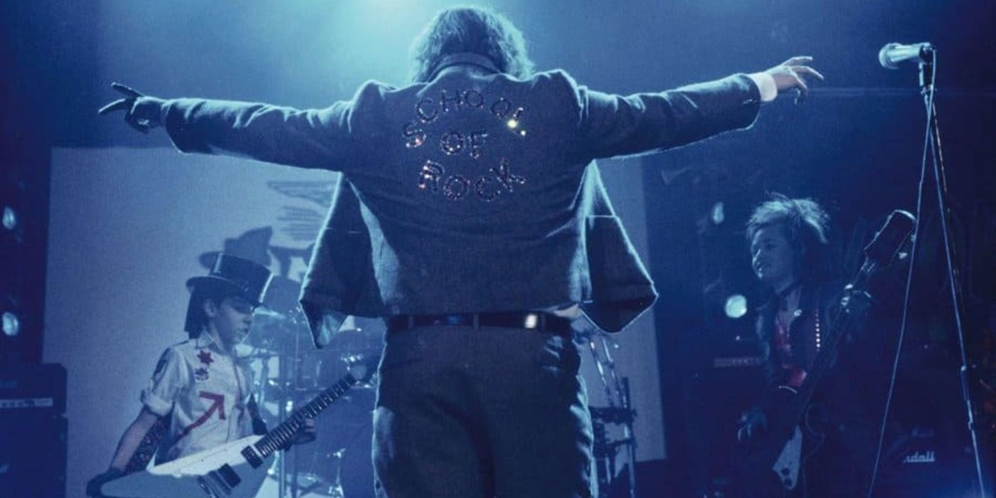 Jack Black reveals his jacket in School of Rock on stage.