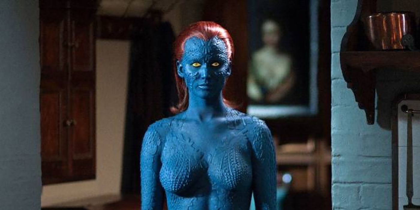 Jennifer Lawrence as Mystique, dressed all in blue make-up with red hair.