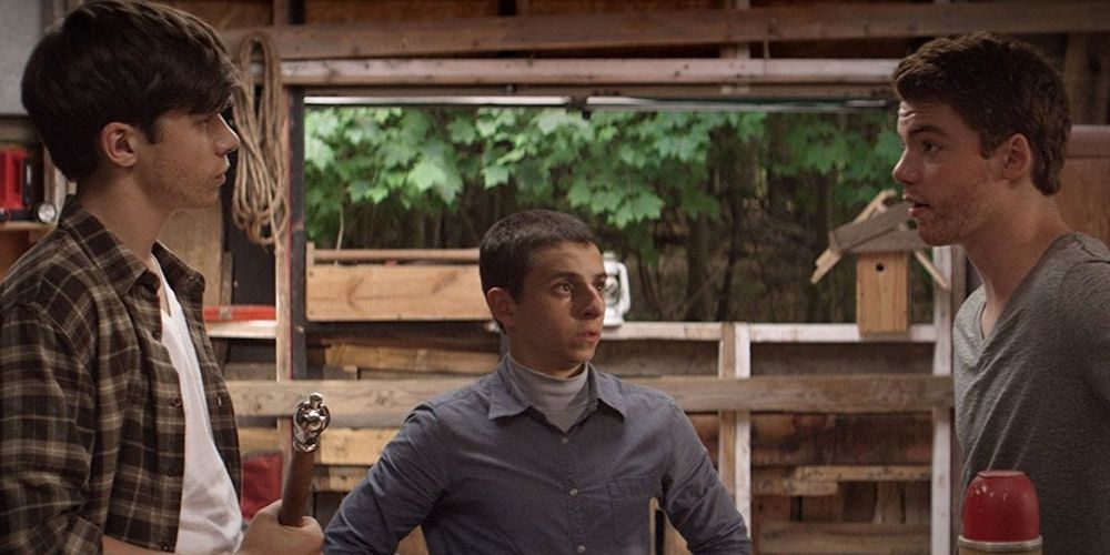 The boys face each other in the cabin in The Kings of Summer