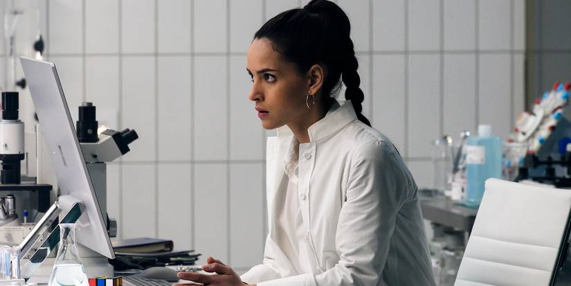 Martine Bancroft working on lab equipment in the Morbius ending