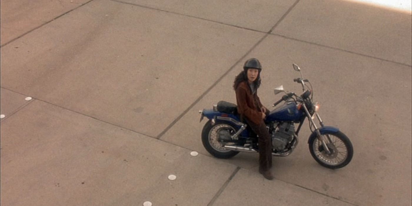 Sandra Oh sitting on a motorcycle in Sideways.