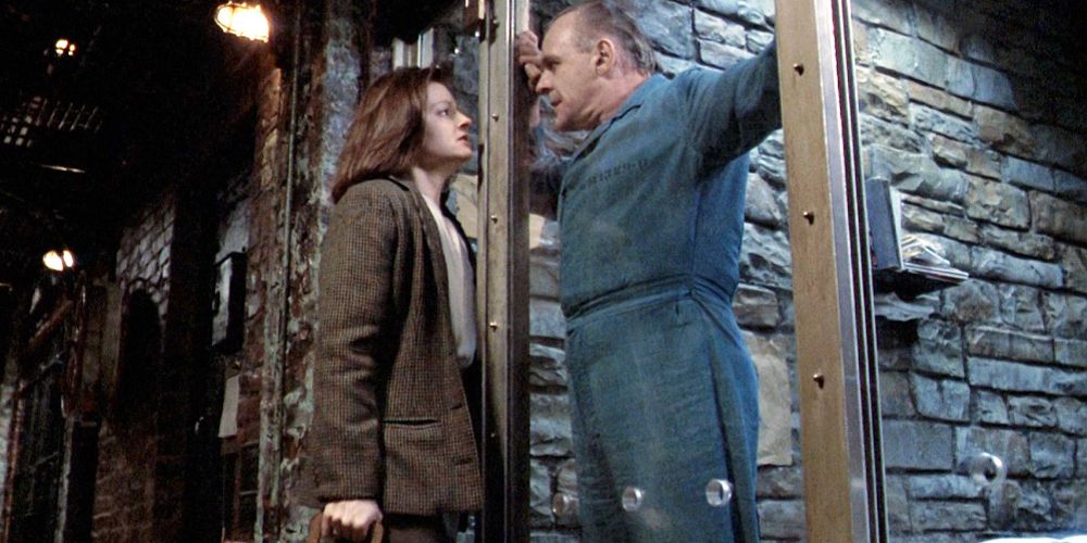 Clarice and Hannibal come face to face through glass in The Silence of the Lambs