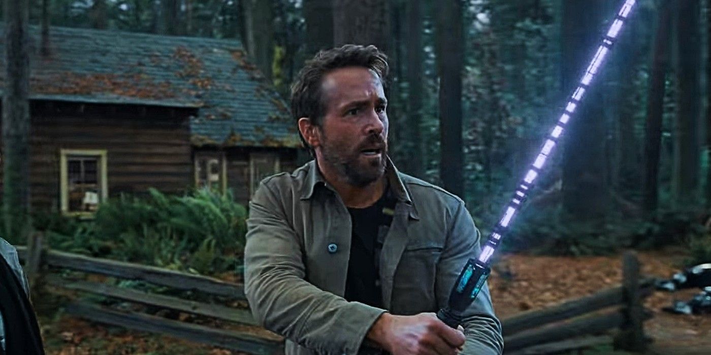 Ryan Reynolds holding a lightsaber in The Adam Project.