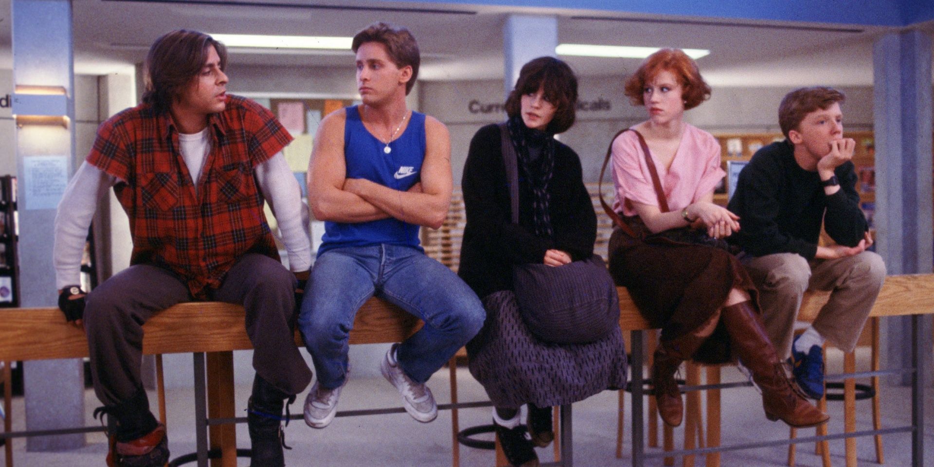 The Breakfast Club sitting on a bannister.