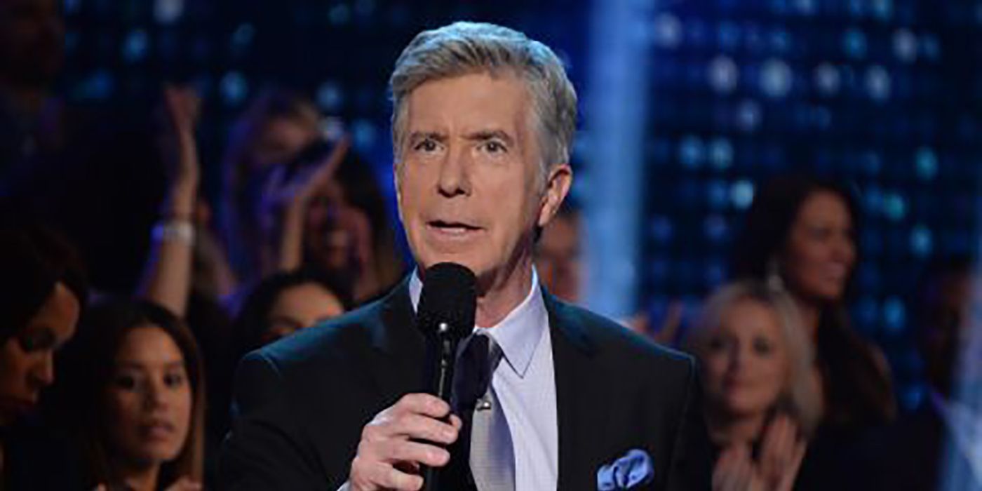 Tom Bergeron on stage with a mic on Dancing With the Stars.