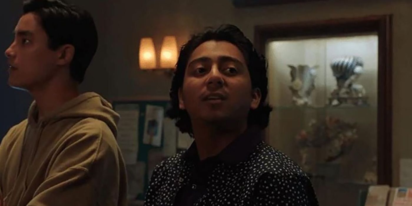 Tony Revolori raising his head in a scene from Spiderman: No Way Home.