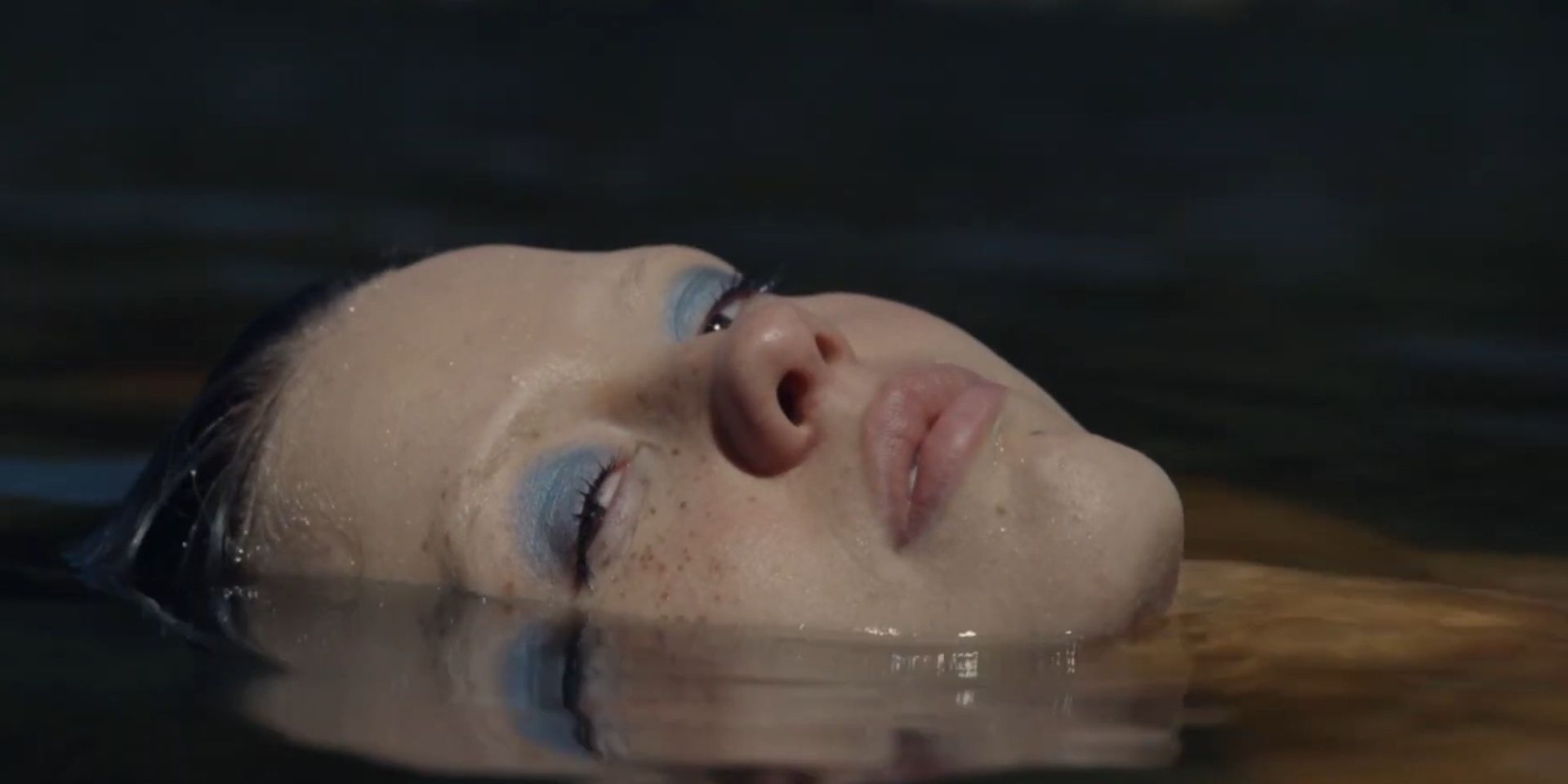 Mia Goth in the water looking at the camera in A24's X