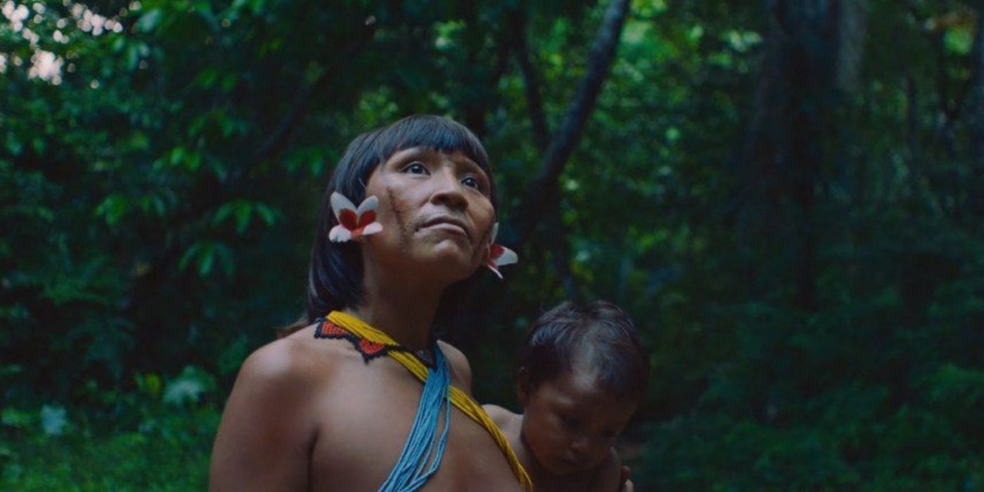 A woman carries her baby in the Amazon in the documentary The Last Forest