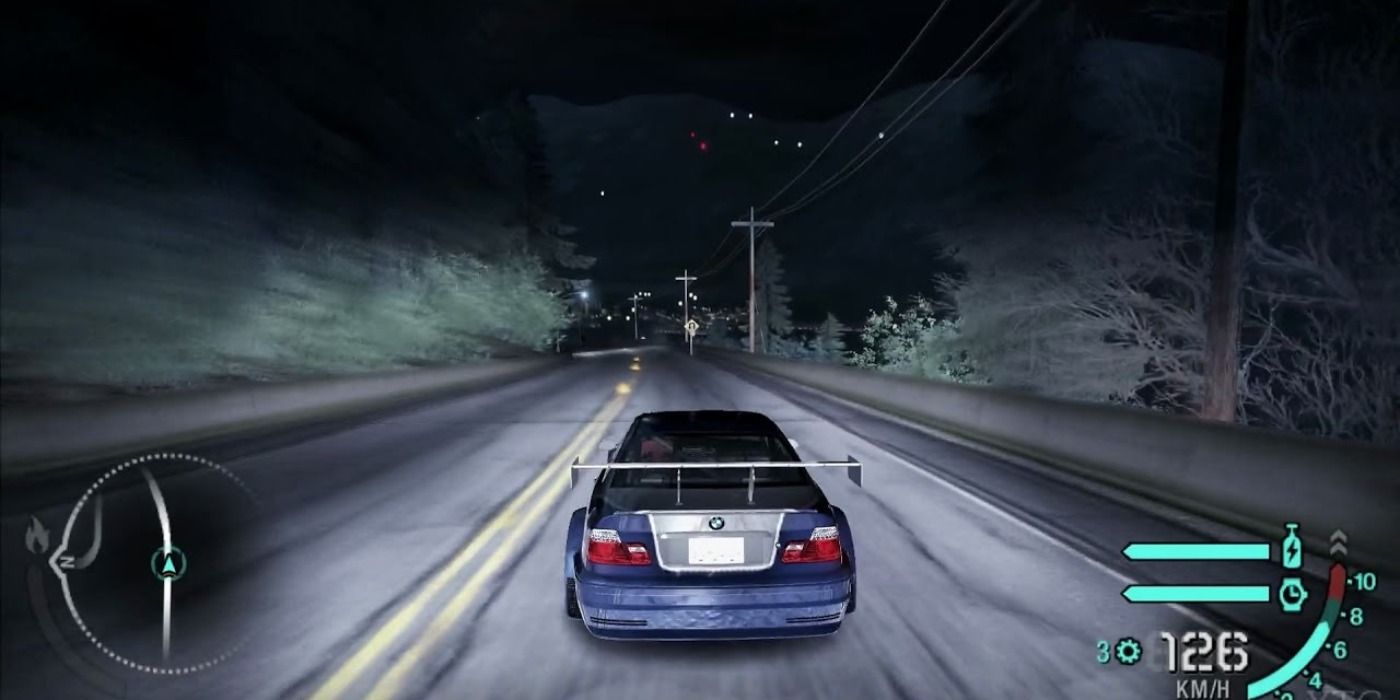 A BMW speeds along a highway in Need For Speed Carbon