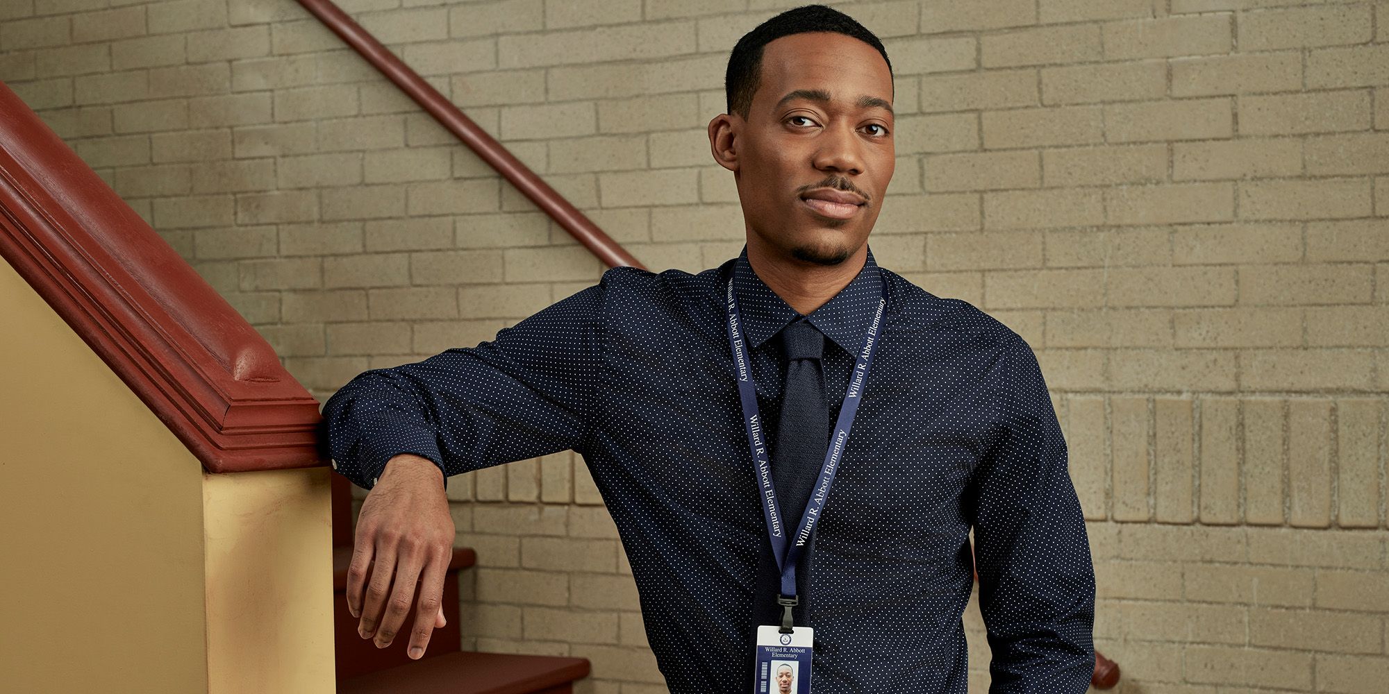 Tyler James Williams as Gregory Eddie looking at the camera with confidence in Abbott Elementary.