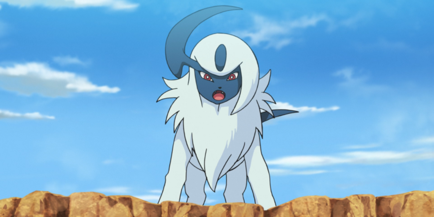 Absol stands atop a ledge in the Pokemon anime.