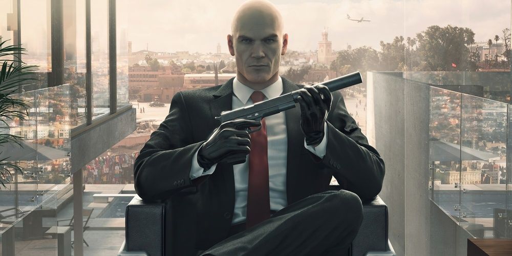 Agent 47 with a gun in hand in Hitman 