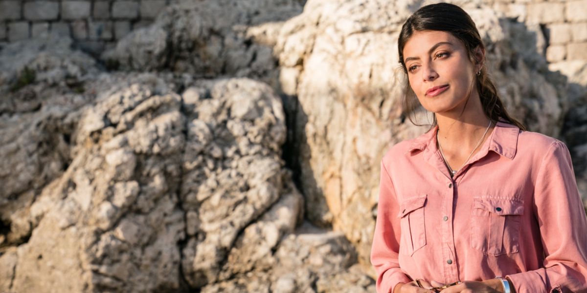 Gabriela (Alessandra Mastronardi) looking somber in The Unbearable Weight of Massive Talent