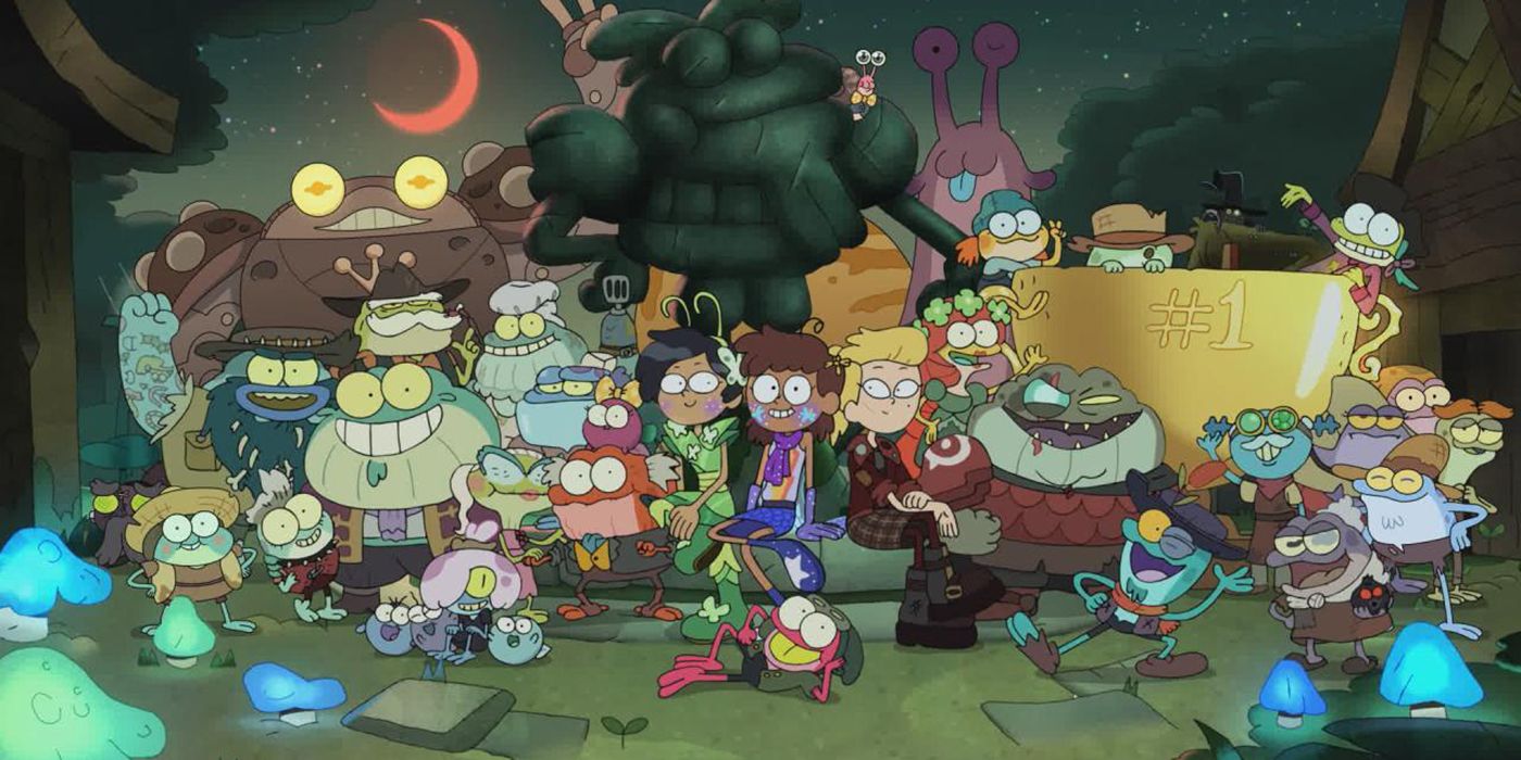 Amphibia's season 3 cast of human and amphibian characters posing in front of a statue and trophy
