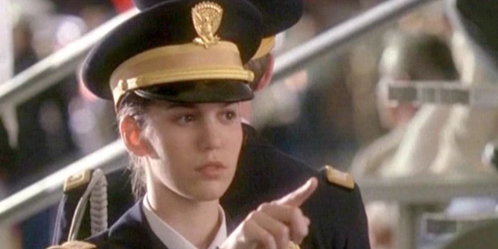 An image of Jennifer Stone pointing to someone off-screen in Cadet Kelly
