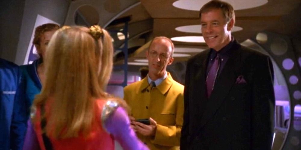 An image of Parker and Mr Lutz smiling at two school children in Zenon