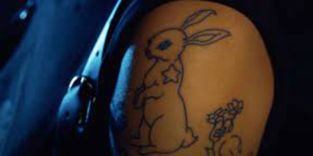 An image of a White Rabbit tattoo in Matrix Resurrections