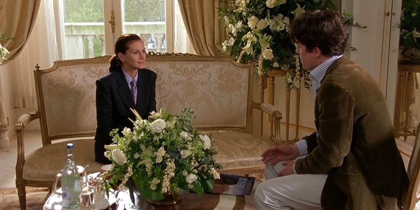 Anna Scott and William Thacker talking in a hotel room in Notting Hill