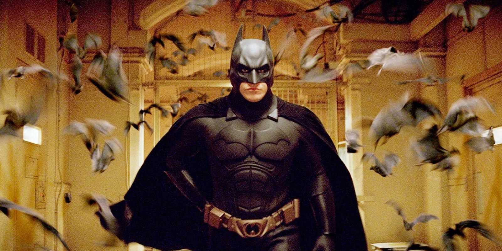 Batman surrounded by bats in Batman Begins