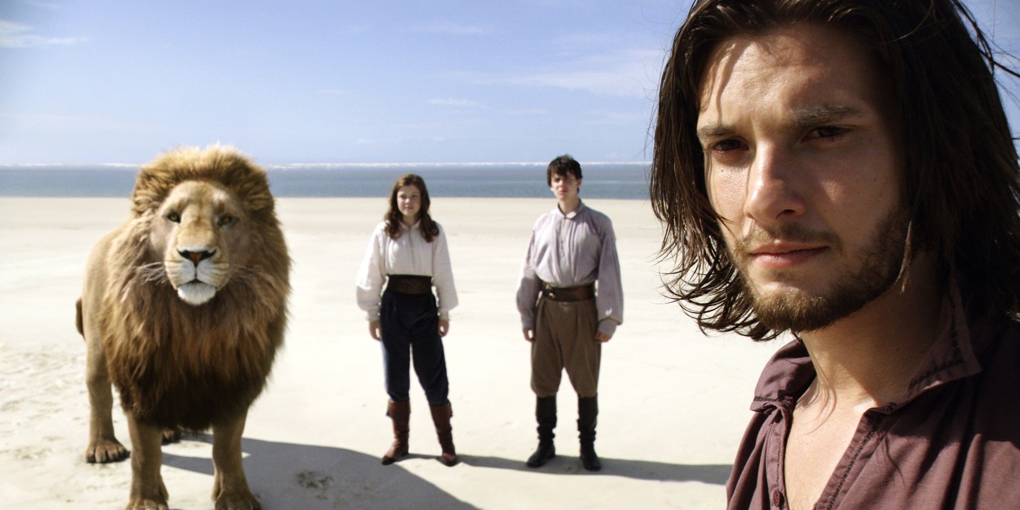 Caspian, Aslan, Edmund, and Lucy on a beach in Voyage Of The Dawn Treader
