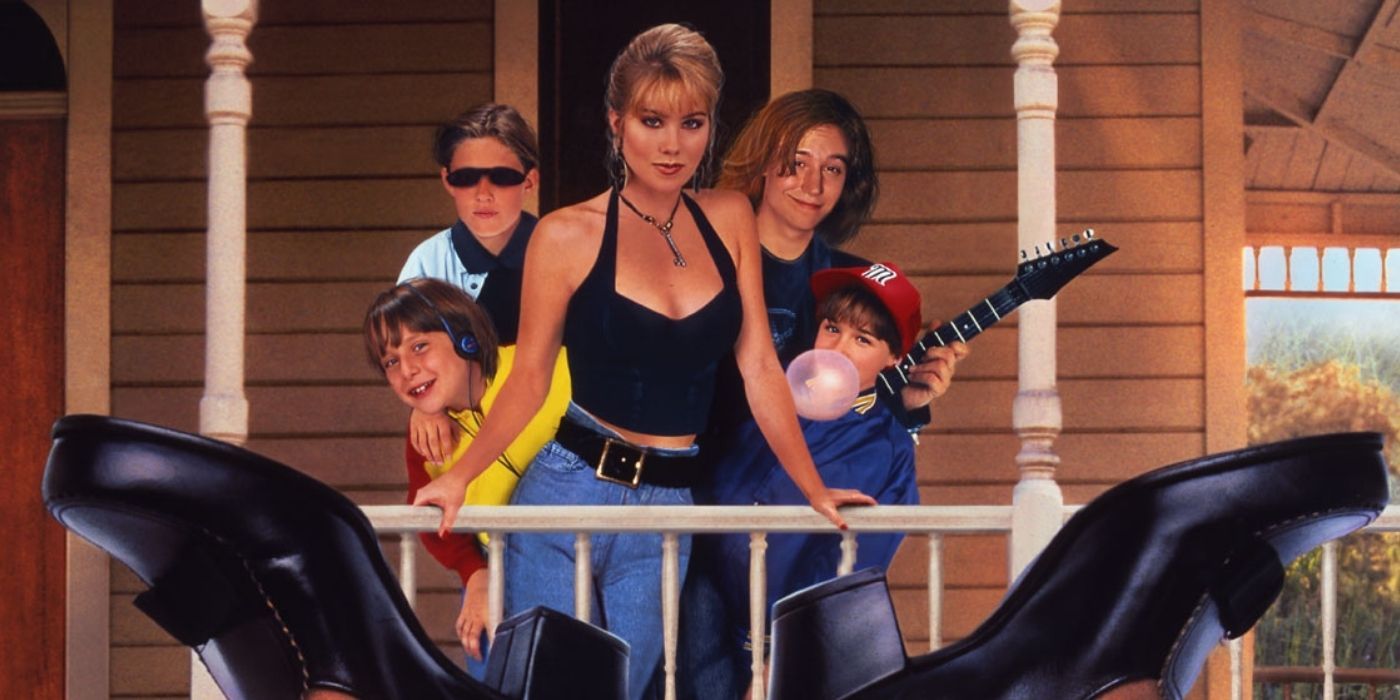 Sue Ellen and her four siblings standing on the front porch and their babysitter's feet in the forefront