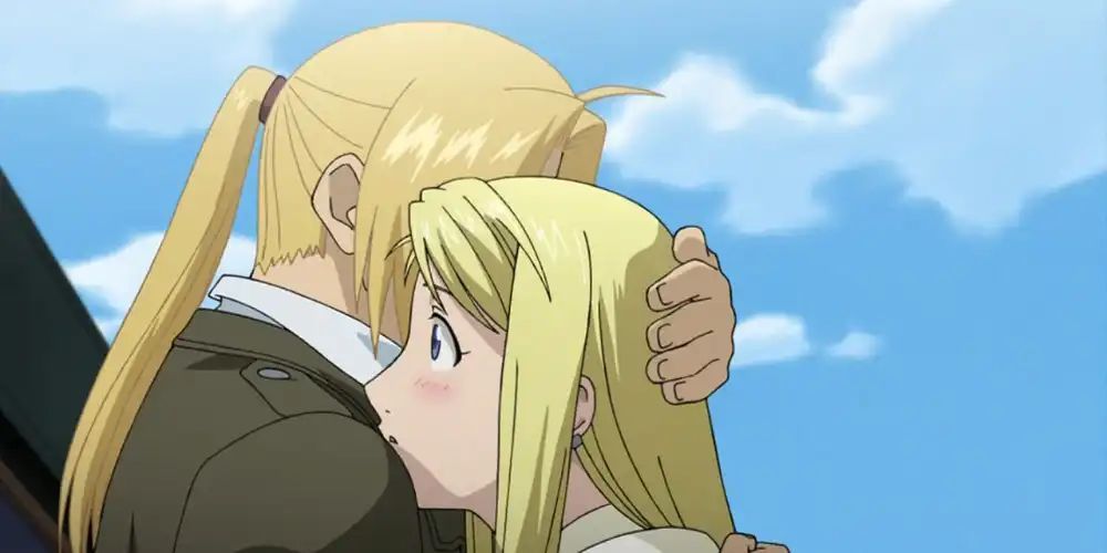 Edward Elric and Winry hugging at the end of Fullmetal Alchemist: Brotherhood