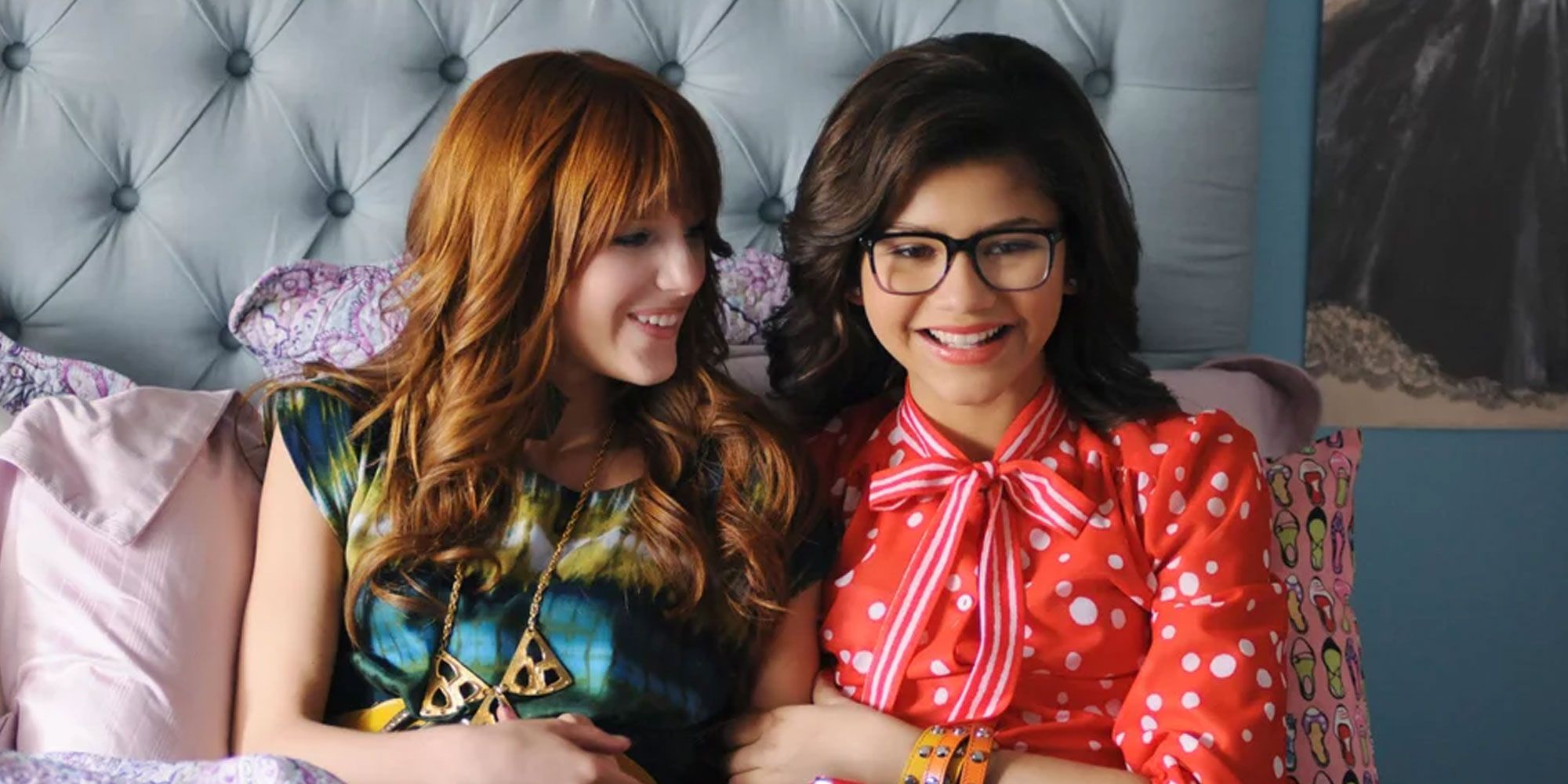 Bella Thorne and Zendaya sit on a bed in Frenemies