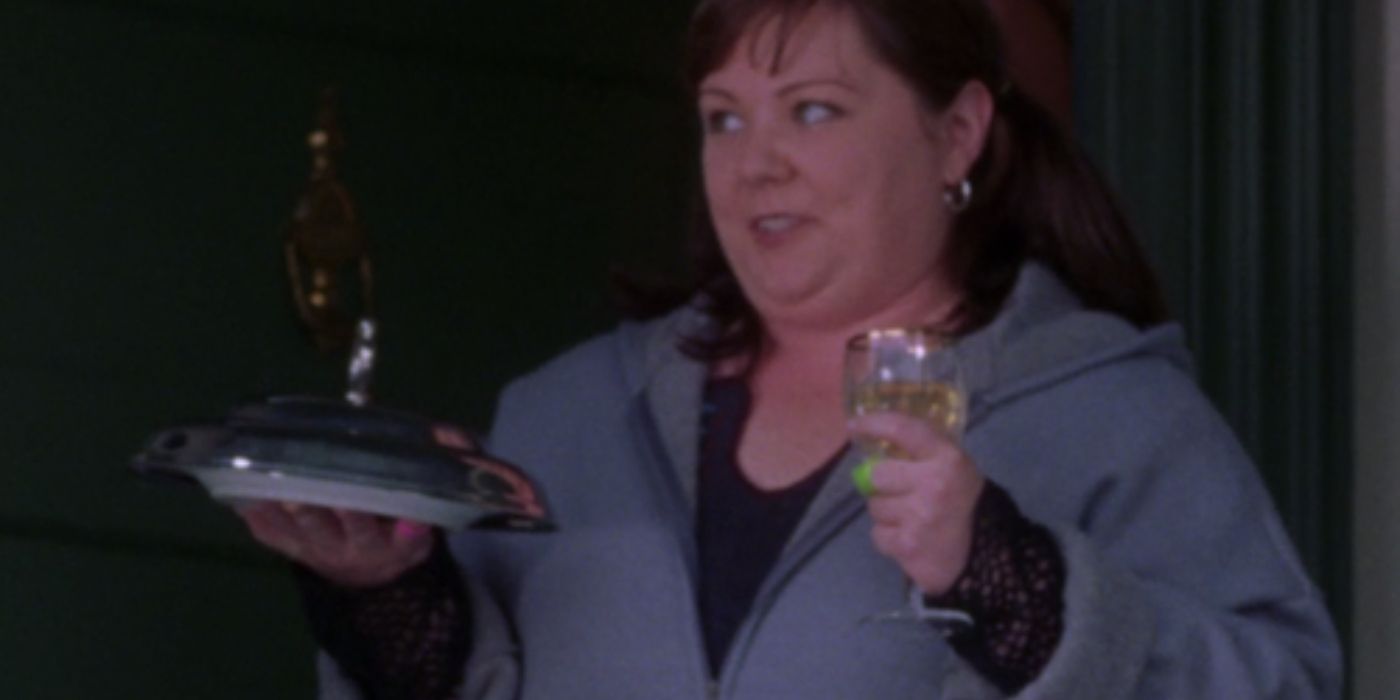 Sookie holding up wine and risotto on Gilmore Girls 
