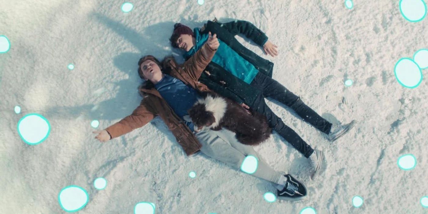 Nick and Charlie lying in the snow in Heartstopper.