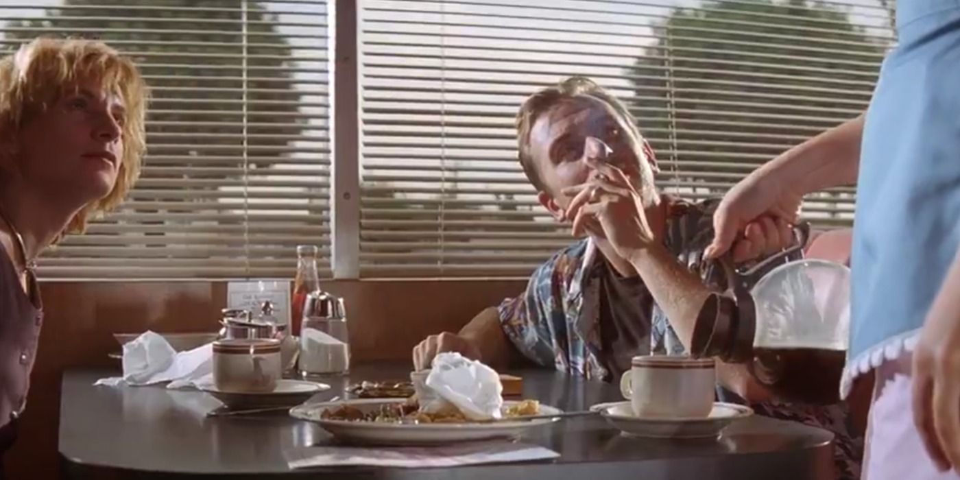 The waitress refills a coffe cup as Honey Bunny and Pumpkin watch in Pulp Fiction