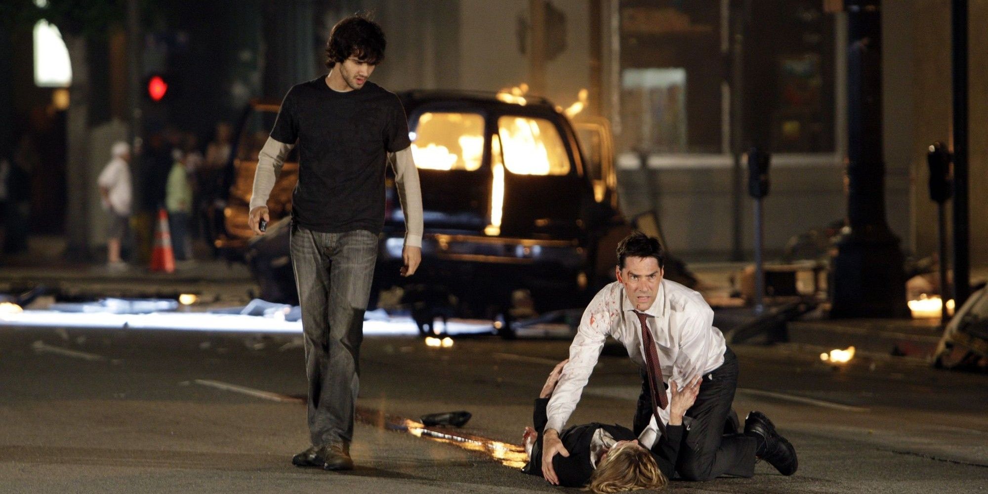 Hotchner looking after an injured woman after a car bomb exploded in Criminal Minds