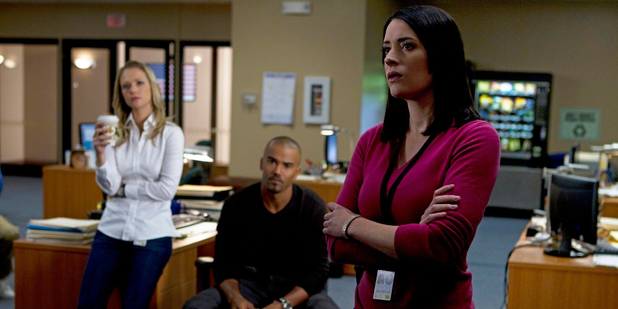 JJ, Emily and Morgan standing and discussing a case in Criminal Minds