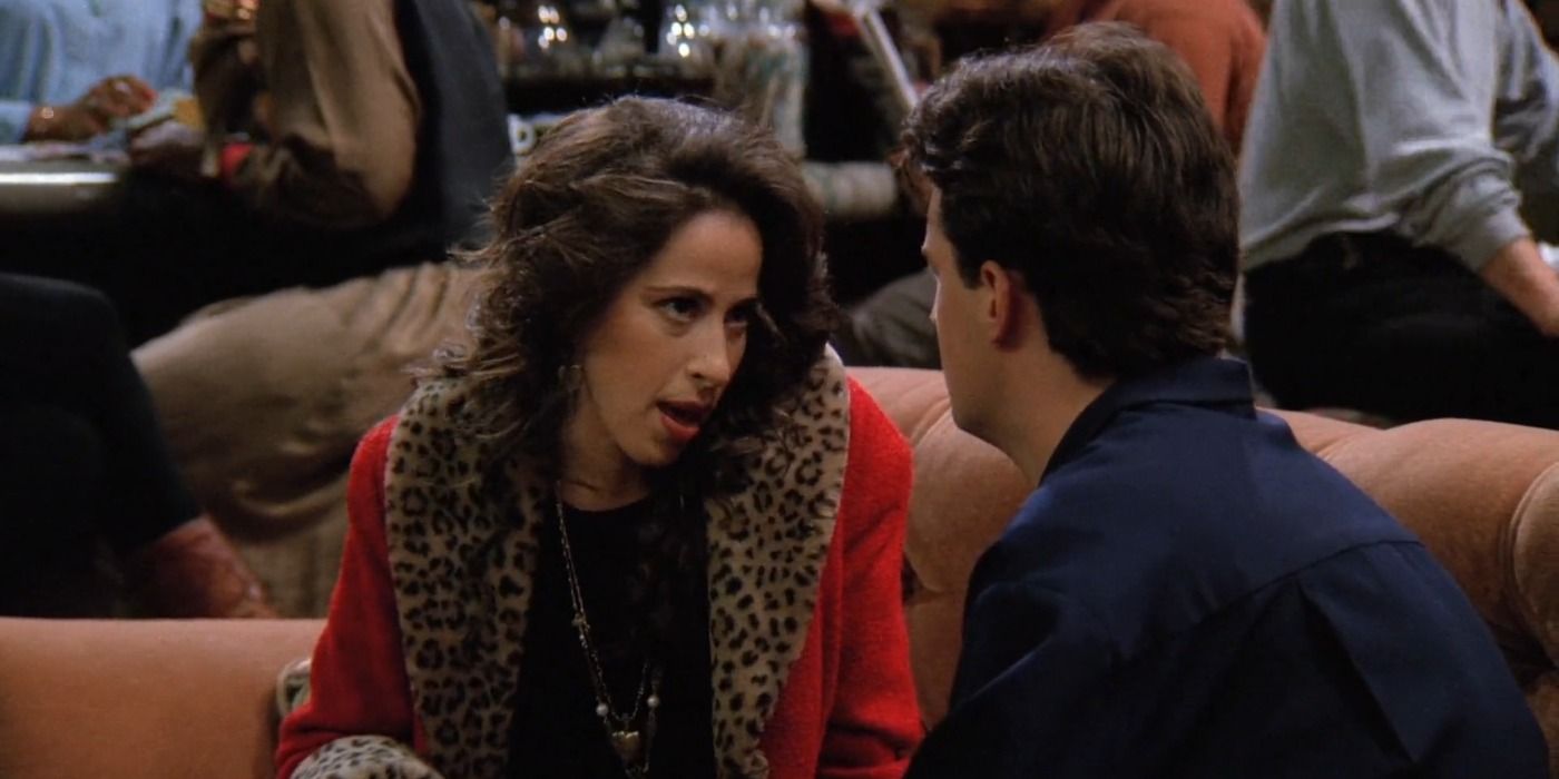 Janice and Chandler sitting on the orange couch in Central Perk in Friends