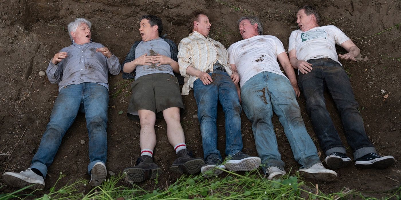 The main characters from The Kids In The Hall lying on the ground.